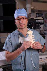 Surgeon 'gluing' the breastbone together after open-heart surgery