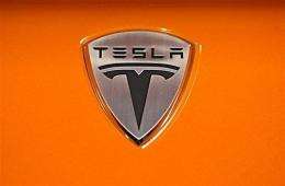 Tesla Motors logo  is seen on the hood of a Tesla Roadster