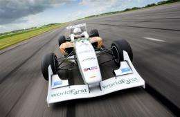 The WorldFirst Formula 3 racing car drives down the straight of a test track at Bruntingthorpe, near Lutterworth
