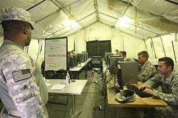 US soldiers spend their break browsing the internet at their base in Basra, Iraq