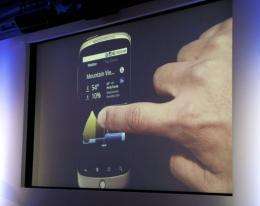A man demonstrates a weather application on the Nexus One smartphone running the Android platform