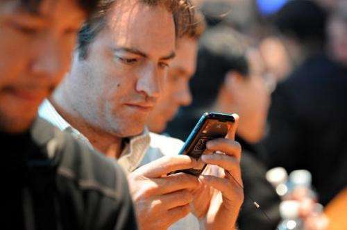 A man looks at a smartphone in Las Vegas
