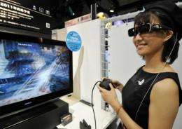 A model demonstrates a 3D videogame content for PlayStation 3 videogame console at the Tokyo Game Show
