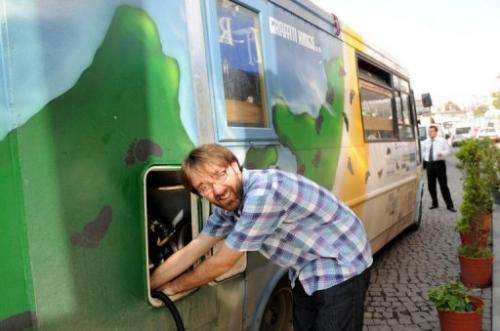 Eco-adventurer Andy Pag re-fuels his truck with vegetable oil from a Turkish restaurant in Istanbul