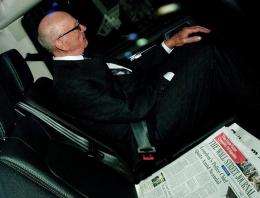 News Corporation Chief Rupert Murdoch is pictured with a copy of the Wall Street Journal newspaper