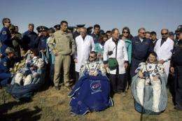 The International Space Station crew after their Soyuz capsule landed safely