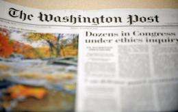 The Washington Post Co. said revenue was flat in its newspaper publishing division in the first quarter