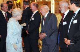 Queen Elizabeth II (2L) speaks with naturist David Attenborough (3R), Chief Scout Bear Grylls (R) and Chris Bonnington