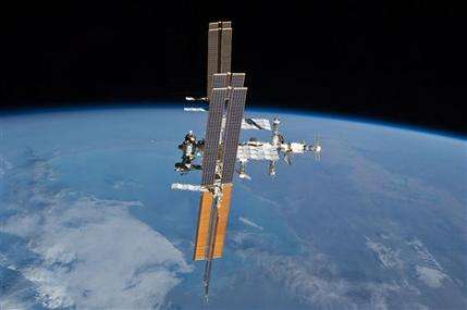 Spacewalking astronauts nix release of satellite (AP)