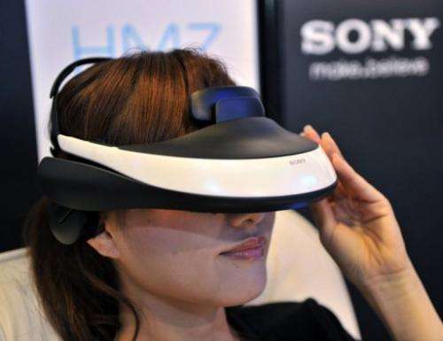 A model displays the new Sony 3D head mount display during an unveiling ceremony in Tokyo