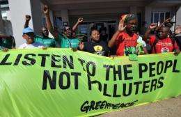 Greenpeace activists demonstrate at the climate change talks in Durban