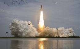 US space shuttle Atlantis is shown launching for the final flight of the shuttle program