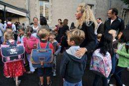 Adults accompany children to school