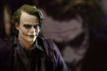 A figurine featuring the Joker of Batman film "The Dark Knight"