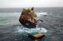 A handout photo taken on October 12 shows containers floating near the grounded container ship 'Rena