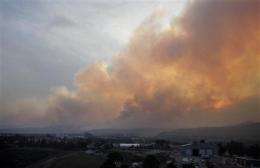Airplane deployed to monitor air over NM fire (AP)