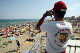 A life guard watches the beach at Canet-en-Roussillon, France, in August