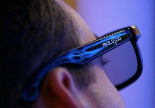 A man wears 3D glasses while watching a demonstration at the Sony booth during a consumer electronics fair in Las Vegas