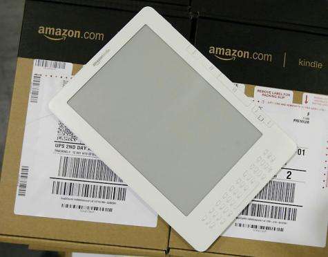 Amazon on Monday introduced a cut-price version of its Kindle electronic reader that features on-screen ads