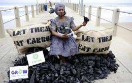 An Oxfam activist stages a protest at the climate change talks in Durban