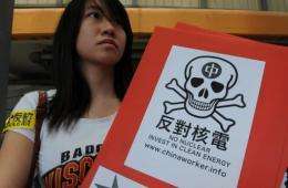 Anti-nuclear protesters hold a demonstration outside China Light and Power in Hong Kong in April