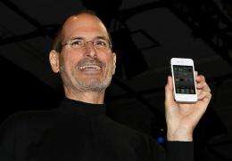 Apple CEO Steve Jobs holds the iPhone 4