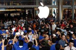 Apple on Saturday threw open the doors to its first store in Hong Kong