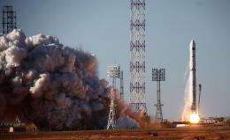 A rocket carrying the Spektr-R space telescope blasts off from Baikonur cosmodrome