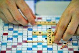A Scrabble player displays his letters under a giant tent during the 37th World Scrabble Championships in Dakar
