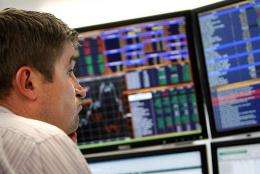 A trader monitors the markets