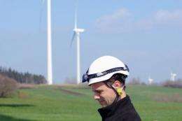 A Vestas engineer at work neat wind turbines at Salles-Curan, central France