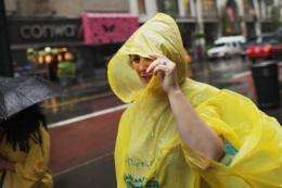 A woman walks down the street in the rain on September 6, in New York City