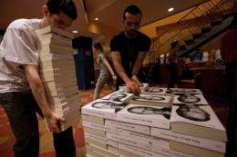 Bookshop employees in Sao Paulo pile up copies of a biography of Apple co-founder Steve Job, in Sao Paulo