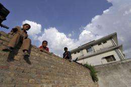 Boys outside the Pakistani hideout of Al-Qaeda leader of Osama bin Laden