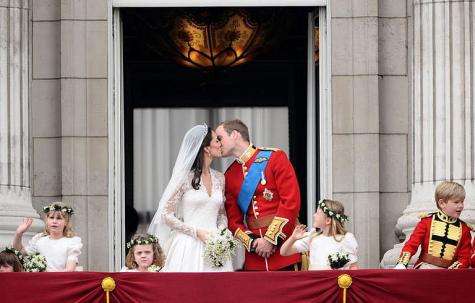 Britain's Prince William and his wife Kate, Duchess of Cambridge kiss