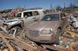 Cars and homes lay in ruins in Tuscaloosa