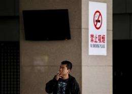 China renews push to ban smoking starting May 1 (AP)