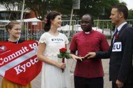 Christian Aid supporters stage a mock ceremony in Durban to support an extension of the Kyoto climate change protocol