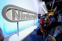 Crowds line up to see the new Nintendo game console Wii U at the Nintendo booth during the Electronic Entertainment Expo