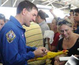 Crowd welcomes home, thanks final shuttle crew (AP)