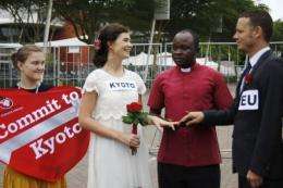Demonstraters hold a mock wedding ceremony outside the climate talks in Durban