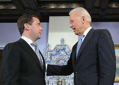 Dmitry Medvedev (L) talks with Joe Biden