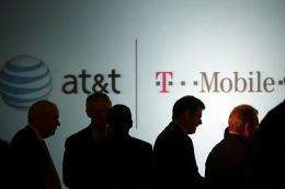 Executives at AT&T attend a news conference where it was announced that AT&T Inc. will be buying T-Mobile USA