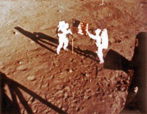 File photo shows US astronauts Neil Armstrong and "Buzz" Aldrin deploying the US flag on the moon on July 20, 1969