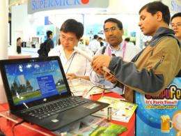 Foreign visitors inspect Chinese products on display  at Computex in Taipei