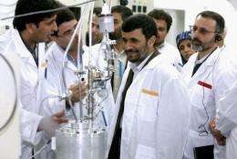 Iranian President Mahmoud Ahmadinejad visits a uranium enrichment facility