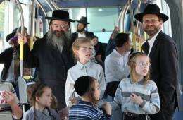Israelis enjoy a ride as Jerusalem's light rail system begins operating in central Jerusalem today