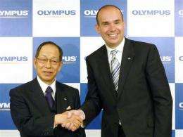 Japan insurer reduces scandal-ridden Olympus stake (AP)