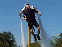 Jet-pack man soaring above California waters