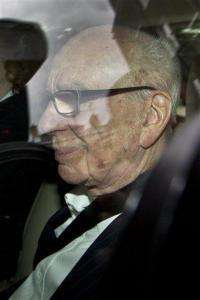 Murdoch pressured to testify in phone hack inquiry (AP)